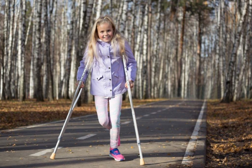 Girl walking with crutches